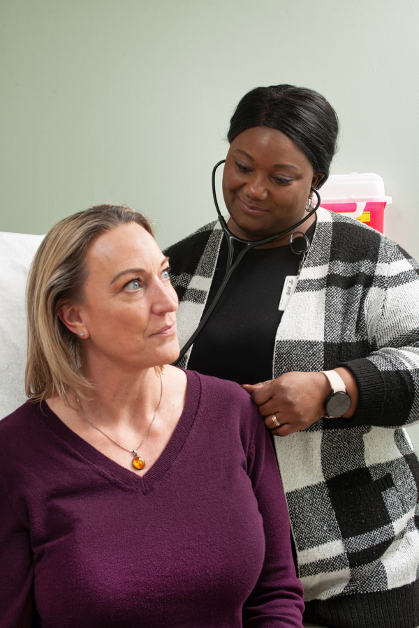 photo of a patient and physician during an exam 