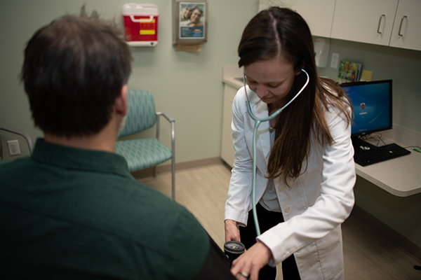 photo of a physician and patient during an exam 
